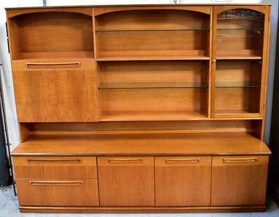 Lot 14 - MEREDEW; a teak dresser, the top with cocktail...