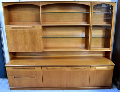 Lot 14 - MEREDEW; a teak dresser, the top with cocktail...