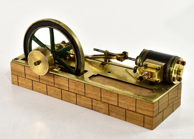 Lot 1011 - A brass scratch built live steam single piston...