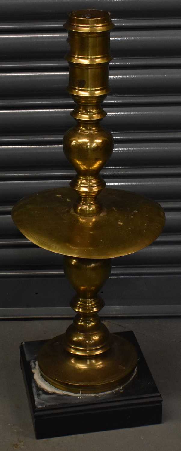 Lot 409 - A tall antique brass Chinese lampstand with...