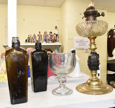 Lot 419 - A vintage oil lamp modelled from a World War I...