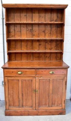 Lot 49 - An Edwardian pine dresser with enclosed plate...