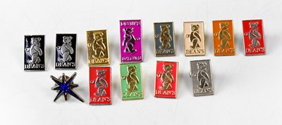 Lot 325 - Thirteen Dean's Collectors Club enamel pins (13).