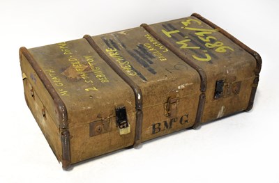 Lot 555 - A vintage metal bound travelling trunk with...