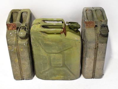 Lot 552 - Three metal jerry cans with applied pressed...