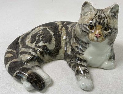 Lot 190 - WINSTANLEY; a tabby cat in a recumbent...