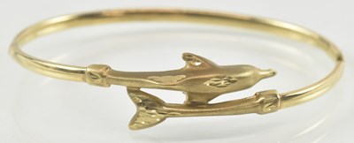 Lot 882 - A 9ct gold dolphin bracelet, internal diameter...