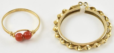 Lot 947 - An 18ct gold dress ring with coral bead style...