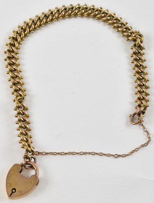 Lot 827 - A 9ct yellow gold bracelet with padlock clasp,...