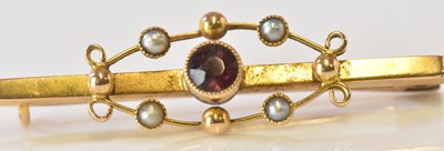 Lot 636 - A 15ct yellow gold garnet and seed pearl bar...