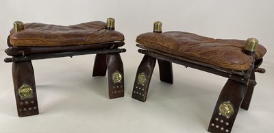 Lot 780 - A pair of leather padded brass capped camel...