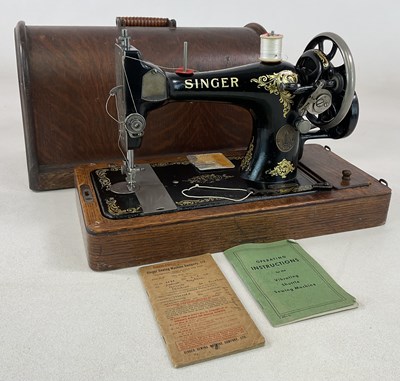 Lot 90 - A cased Singer sewing machine.