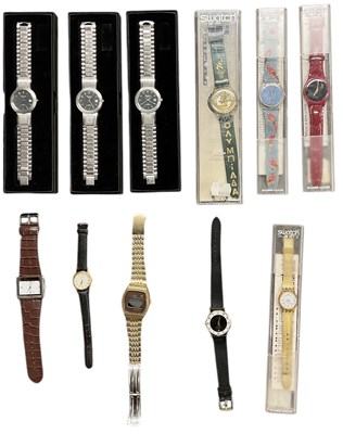 Lot 1054 - SWATCH; four cased watches of different design,...