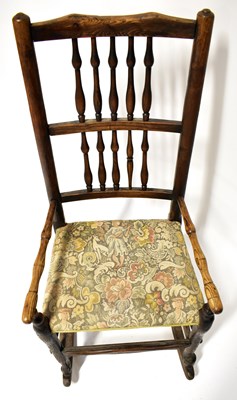 Lot 40 - An American beech wood rocking chair with...