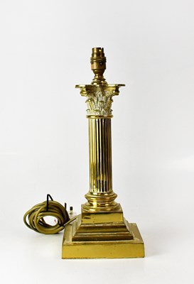 Lot 166 - A brass table lamp in the form of a Corinthian...