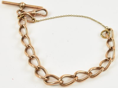 Lot 808 - A 9ct rose gold bracelet, with T-bar and...