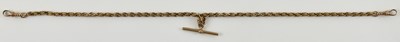 Lot 1010 - A 9ct rose gold watch chain, with T-bar and...