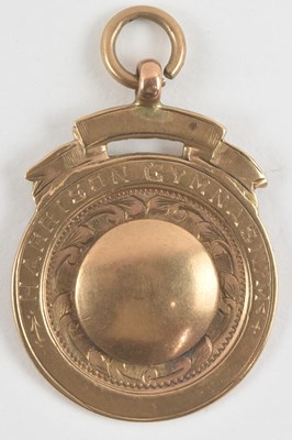 Lot 837 - A 9ct rose gold boxing winner's medal, won by...