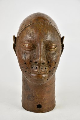 Lot 706 - An African bronze bust, height 37cm.