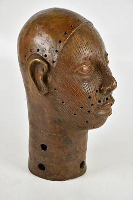 Lot 706 - An African bronze bust, height 37cm.