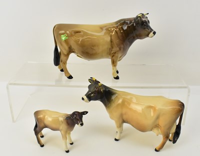 Lot 620 - BESWICK; a family of three Jersey cows...