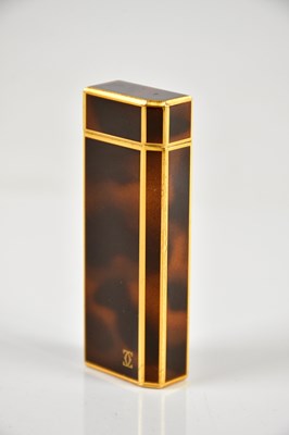 Lot 587 - CARTIER; a tortoiseshell effect cigarette...