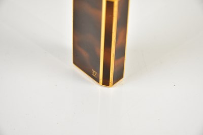 Lot 587 - CARTIER; a tortoiseshell effect cigarette...