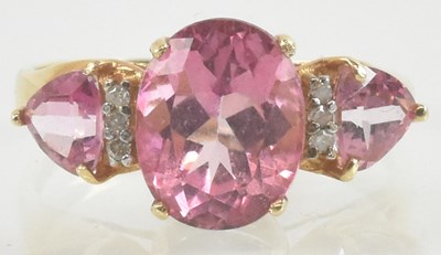 Lot 928 - A 10k pink and white stone set dress ring,...