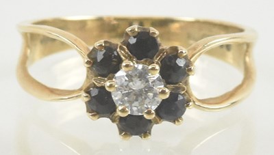 Lot 929 - A 9ct gold white stone and sapphire cluster...