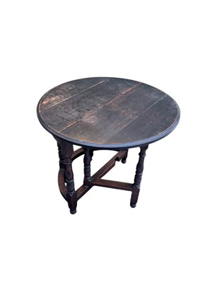 Lot 1058 - A 19th century oak gateleg drop-leaf dining...