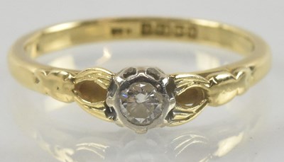 Lot 869 - An 18ct gold diamond solitaire ring, with...