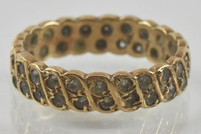 Lot 935 - A 9ct gold eternity ring, with two rows of...