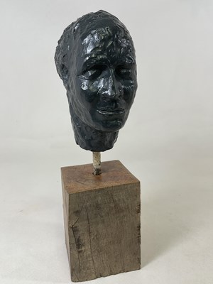 Lot 124 - An unsigned male head presented on wooden base,...