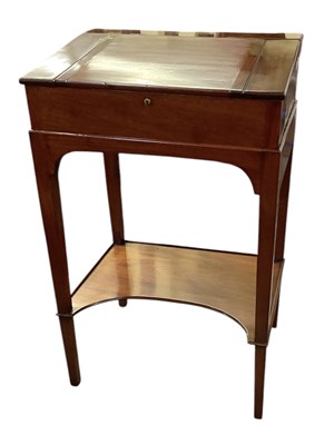 Lot 36 - A reproduction mahogany clerk's desk on stand,...