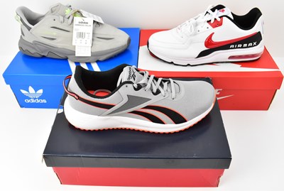 Lot 506 - Three pairs of men's trainers comprising Nike...