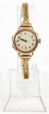 Lot 1025 - A lady's 9ct gold wristwatch, the white...