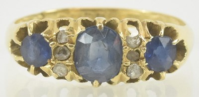 Lot 848 - An 18ct gold sapphire and diamond ring, with...