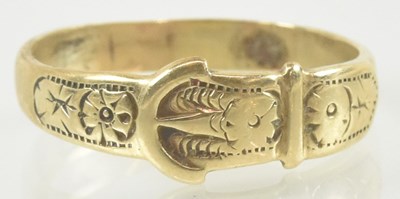 Lot 884 - A 9ct gold buckle ring, size V, approx 3.5g.