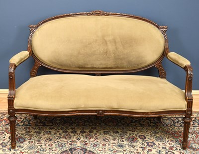 Lot 2742 - An Edwardian carved walnut salon settee, the...