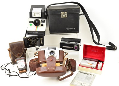 Lot 361 - Four vintage cameras including a Rollei model...