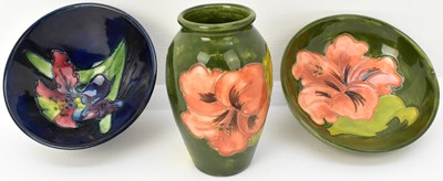 Lot 630 - MOORCROFT; three small cabinet items...