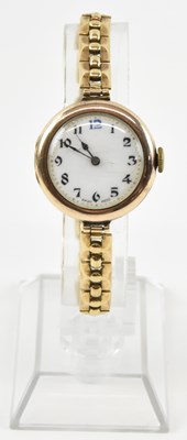 Lot 1011 - A 9ct gold lady's wristwatch, the white enamel...