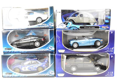 Lot 558 - Six boxed collector's diecast scale model cars...