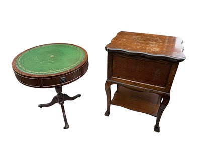 Lot 70 - A reproduction mahogany drum coffee table with...