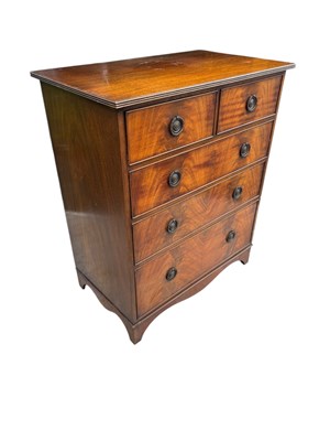 Lot 61 - A reproduction mahogany chest of two short...