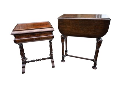 Lot 219 - A 19th century walnut sewing cabinet, the...