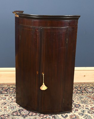 Lot 2814 - A George III mahogany bowfronted hanging...