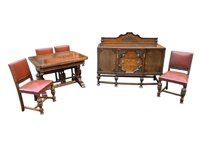 Lot 191 - A 1920s oak dining suite comprising a...