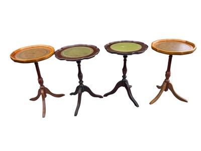 Lot 73 - Four modern tripod wine tables including a...