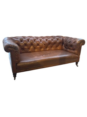 Lot 180 - A brown leather button back Chesterfield sofa,...